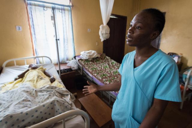 Ganta Hospital nurse Loretta Nyawonse tends to a young female patient recovering from surgery.